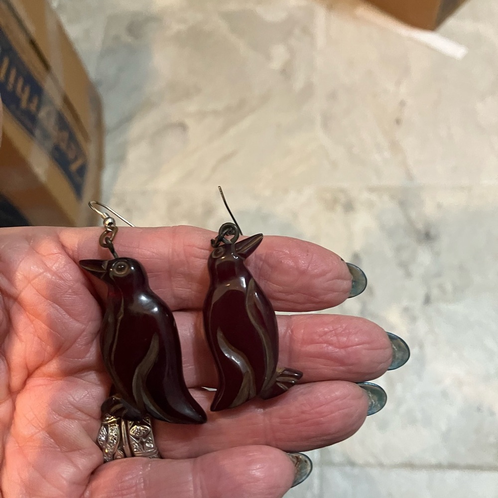 Vintage carved Bakelite cherry Amber penguin bird pierced earrings.